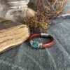 Turquoise Gemstones on a burgundy brown leather