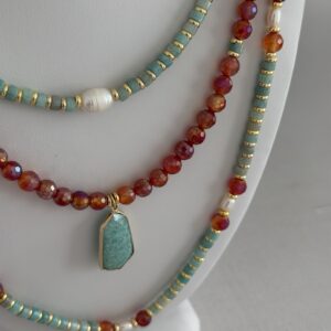 Three necklaces in varying lengths. All with aquamarine, carnelian and pearls.