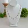 Raspberry pink rose quartz necklace. This necklace is 18’ long and has a chandelier dangle to each bead. The chain in a gold tone.