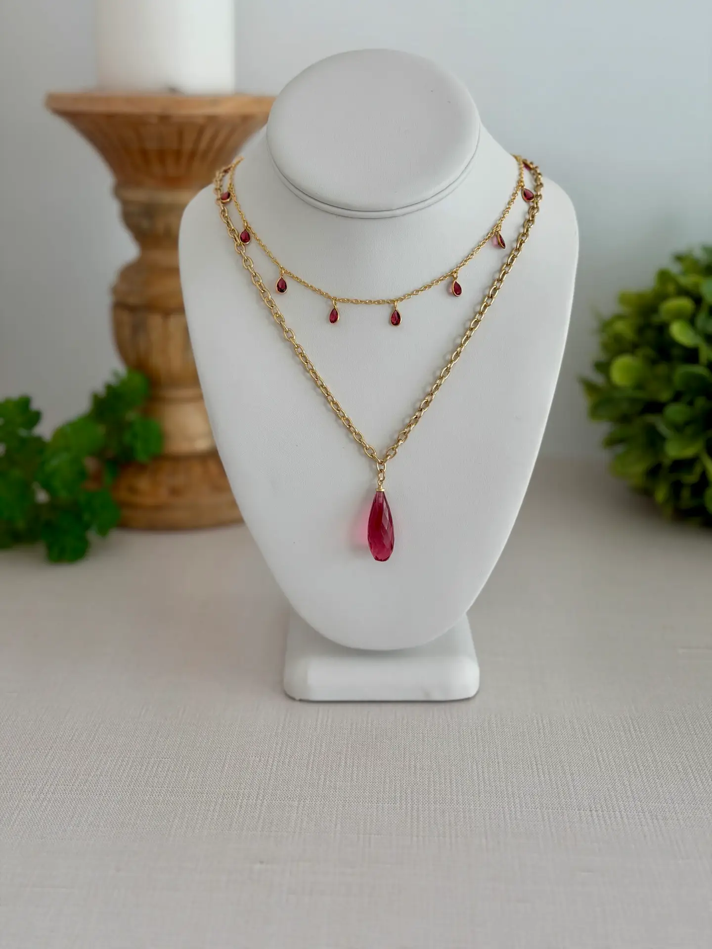 Rose quartz in a raspberry pink teardrop necklace. 18’ long and on a gold plated chain