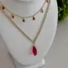 Layered raspberry colored rose quartz necklaces.