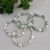 Natural pale blue aquamarine stretch bracelet with silver spacer beads and pearls.