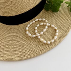 Freshwater Pear Bracelet. The bracelet has gold tone accents and is a stretch style