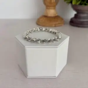 Silver plated beaded bracelet. It is a size seven and a stretch style design.