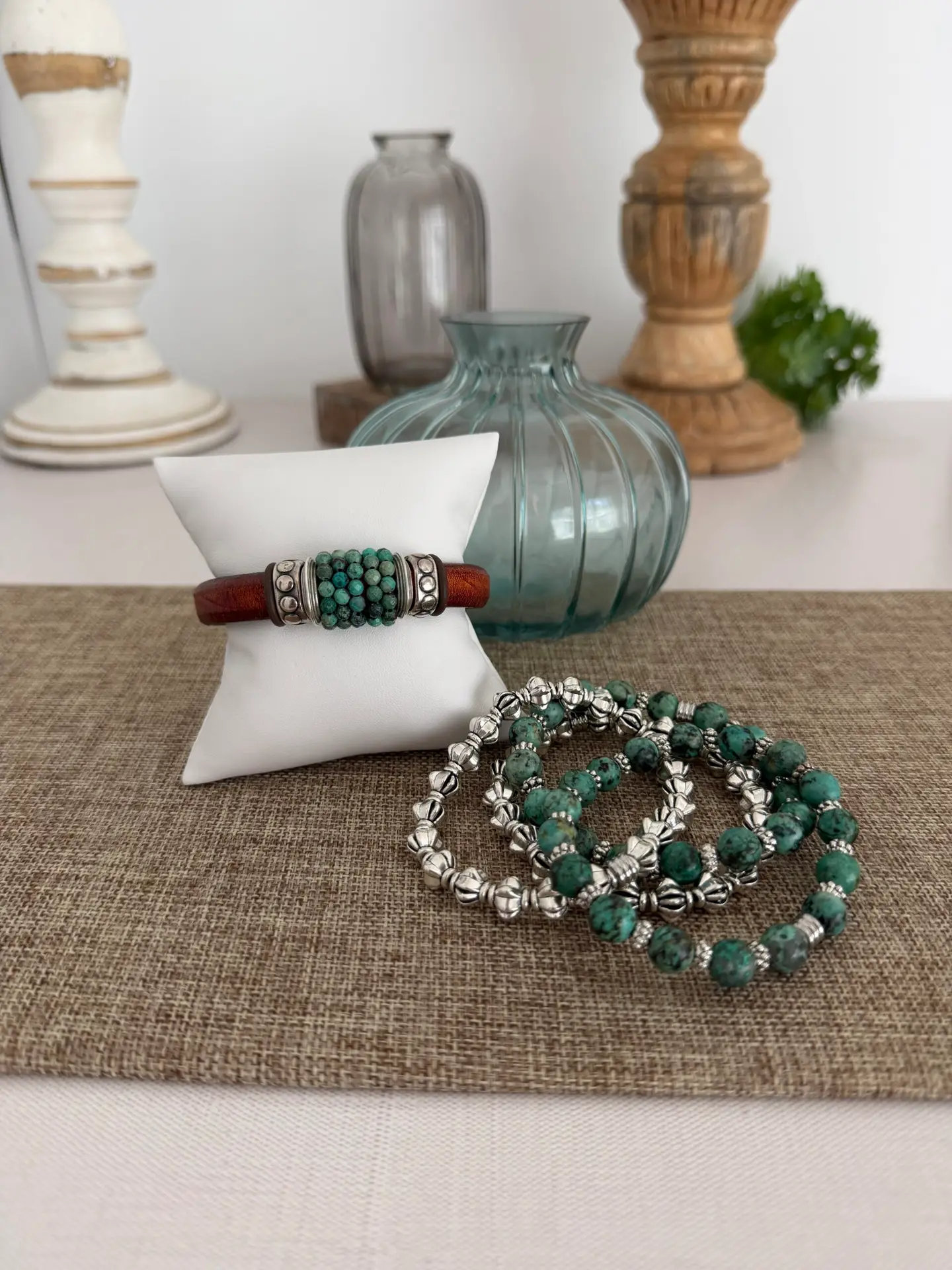 The leather is a Portuguese leather and the gemstone is an African turquoise. The silver accents are perfect for the stone! The leather bracelet has a magnetic clasp. The four matching bracelets are all stretch in style. Two are turquoise and two are a silver tone for creating a smashing look!