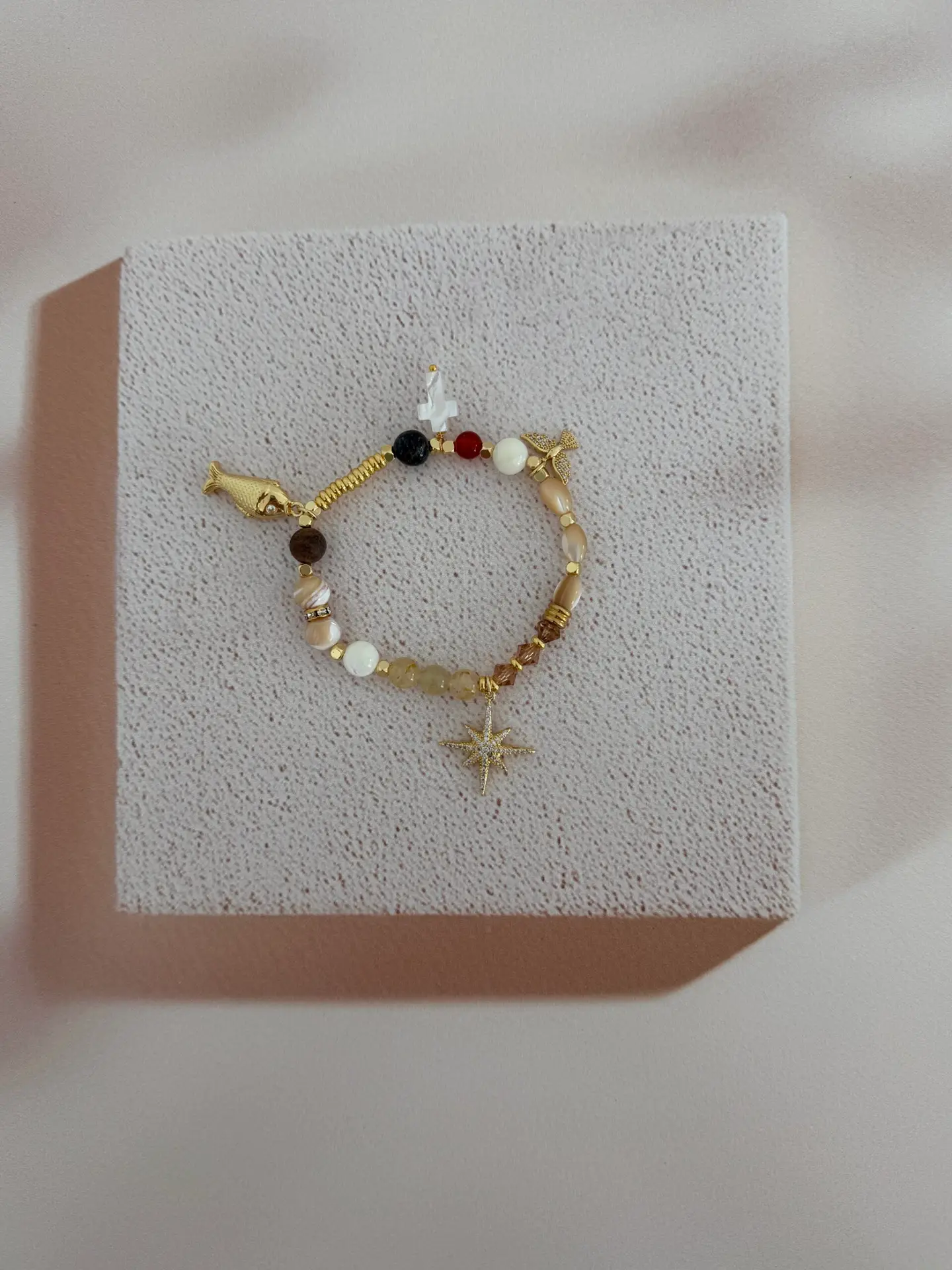 Faith bracelet. Each gemstone bead represents the walk of Christ. It has charms also.