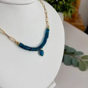 Blue Apatite gemstone in a London blue tone. The beads are hand cut and strung on 1/3 of the necklace with the remaining 2/3 being gold plated paperclip chain. The clasp is gold and in a lobster style closure.